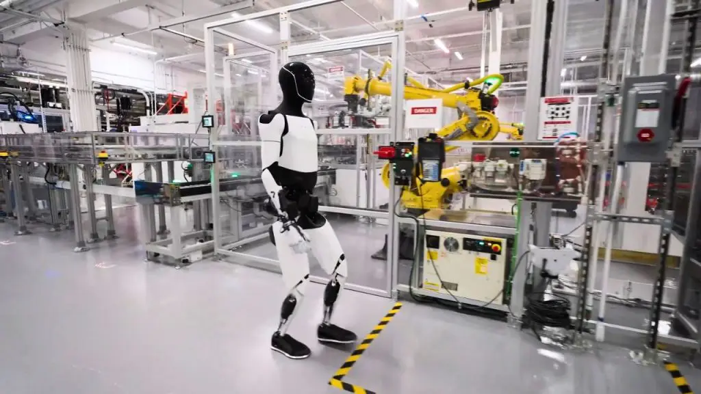 Tesla's Optimus humanoid robot walks in the EV maker's Fremont factory