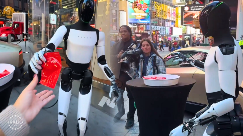 Tesla Optimus humanoid robot hands out candy in Times Square